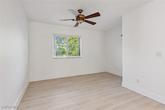 spare room featuring ceiling fan and light hardwood / wood-style flooring