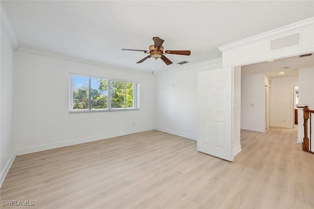 spare room featuring ceiling fan, light hardwood / wood-style floors, and crown molding