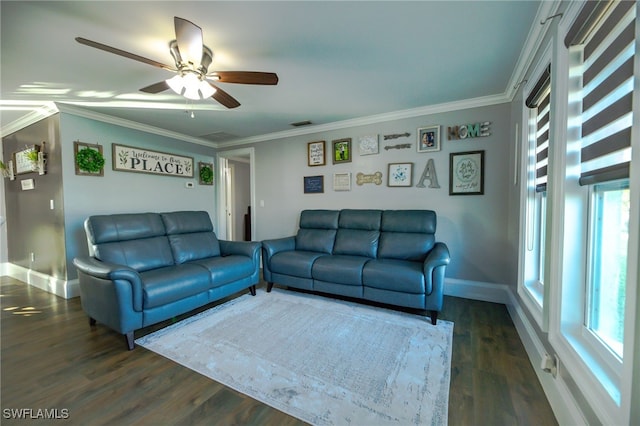 living room featuring dark wood-type flooring, crown molding, ceiling fan, and a healthy amount of sunlight