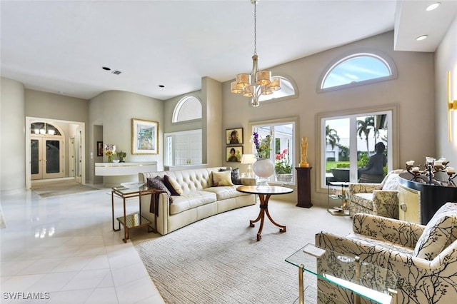 tiled living room with a towering ceiling and an inviting chandelier