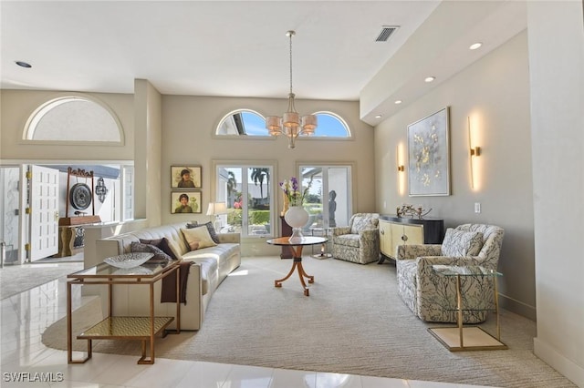 living room with an inviting chandelier