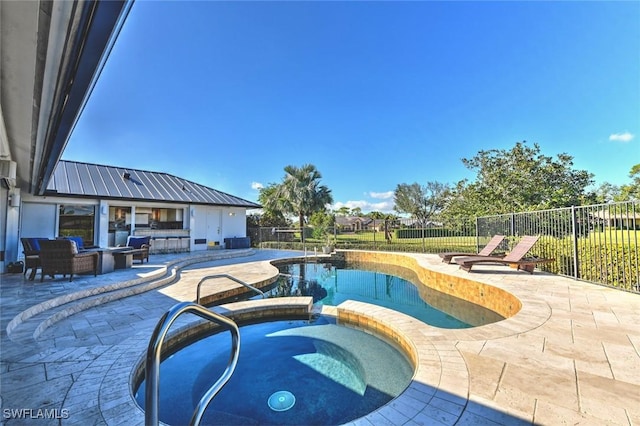 view of swimming pool with an in ground hot tub, an outdoor hangout area, and a patio area