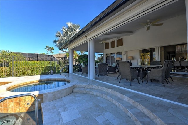 view of patio featuring an in ground hot tub and ceiling fan