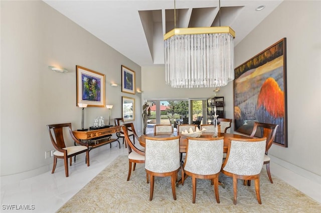 dining space featuring light tile patterned floors