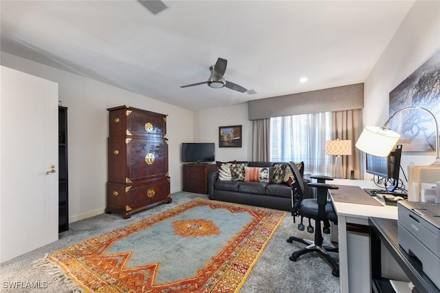 carpeted home office with ceiling fan