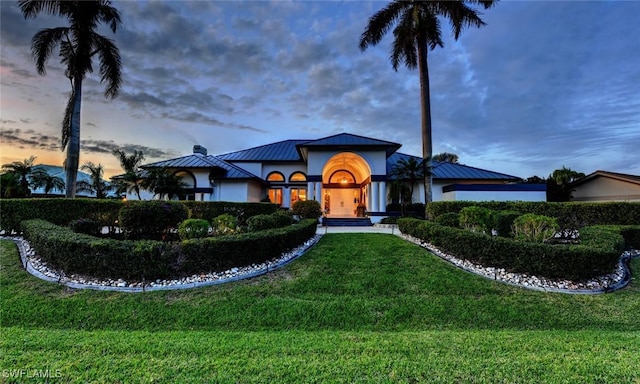 view of front of home with a yard