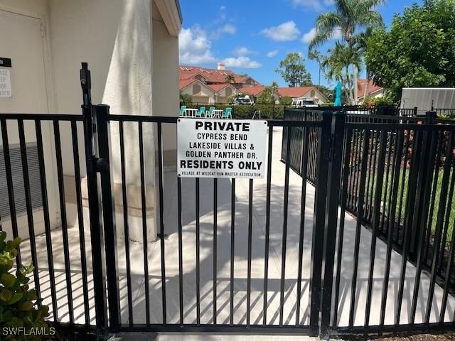 20190 Golden Panther Dr Unit 3, Estero, FL 33928 - gate featuring a residential view