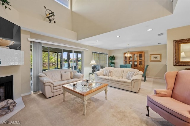 20190 Golden Panther Dr Unit 3, Estero, FL 33928 - living room with light carpet, a fireplace, and recessed lighting