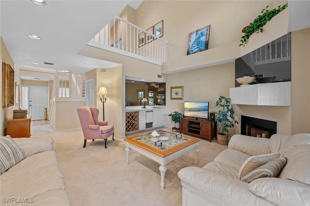 20190 Golden Panther Dr Unit 3, Estero, FL 33928 - living room with light colored carpet, a fireplace, and recessed lighting