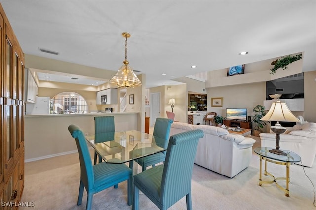 20190 Golden Panther Dr Unit 3, Estero, FL 33928 - dining room featuring light colored carpet, recessed lighting, and a chandelier