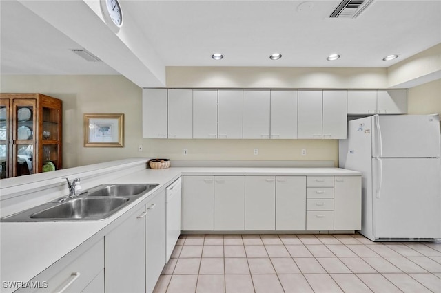 20190 Golden Panther Dr Unit 3, Estero, FL 33928 - kitchen featuring white appliances, light countertops, white cabinetry, recessed lighting, and light tile patterned floors
