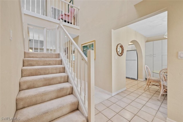 20190 Golden Panther Dr Unit 3, Estero, FL 33928 - staircase with arched walkways and tile patterned floors