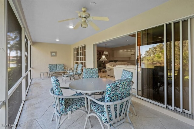 sunroom with ceiling fan