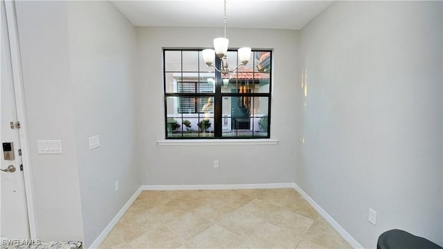 unfurnished dining area with an inviting chandelier