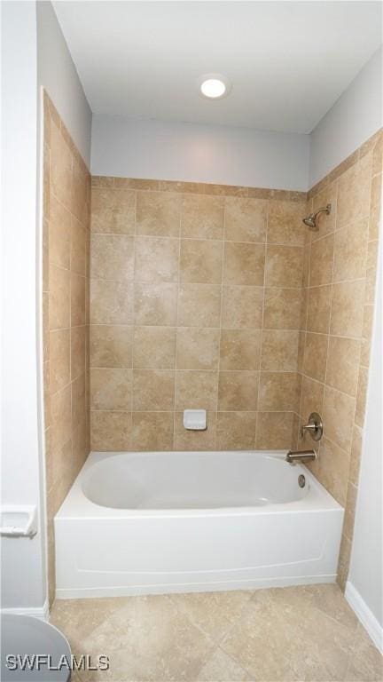 bathroom featuring shower / bathtub combination and tile patterned flooring