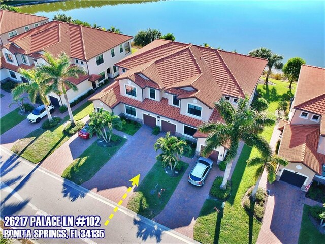 26217 Palace Ln Unit 102, Bonita Springs, FL 34135 - aerial perspective of suburban area featuring a nearby body of water