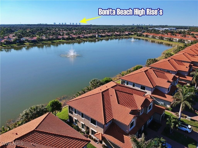 bird's eye view featuring a residential view and a water view