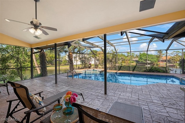 view of swimming pool featuring a water view, ceiling fan, a lanai, an in ground hot tub, and a patio area