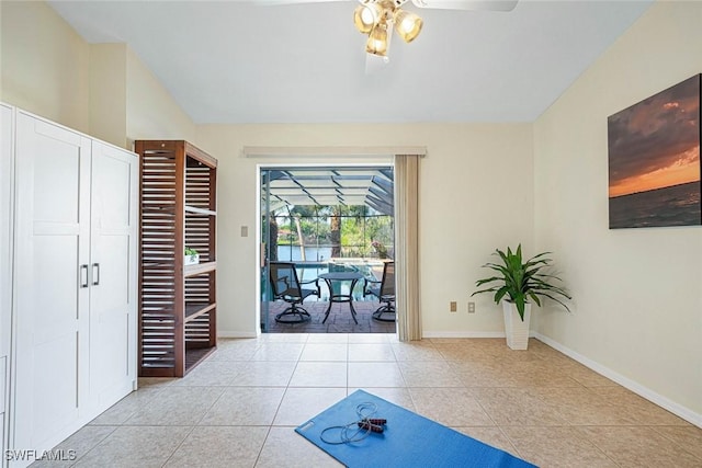 interior space with ceiling fan and light tile patterned floors