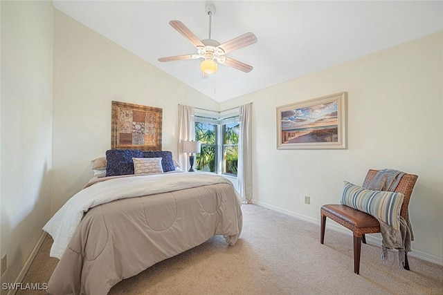 bedroom with ceiling fan, light carpet, and vaulted ceiling