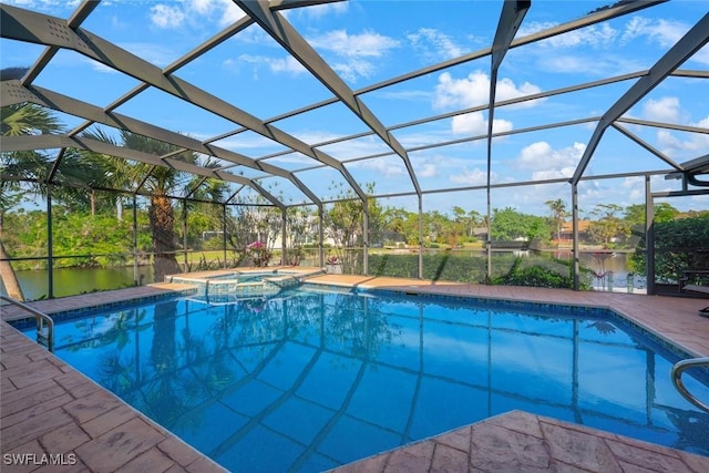 view of pool featuring glass enclosure, an in ground hot tub, a patio area, and a water view