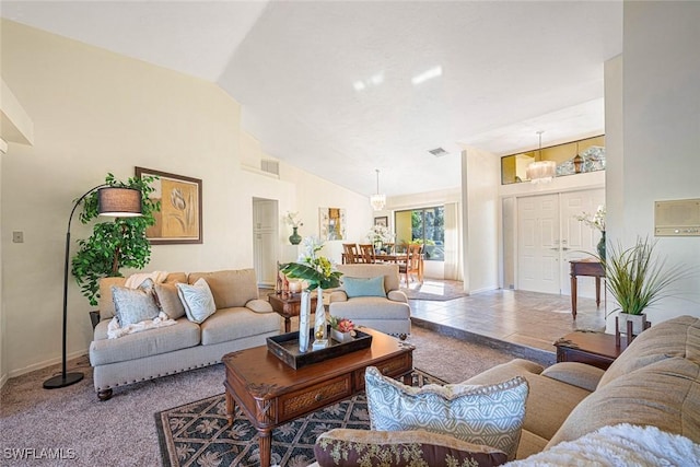 tiled living room with lofted ceiling and a notable chandelier