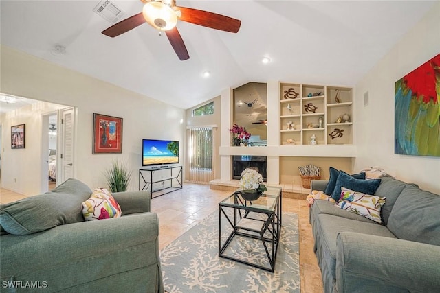 living room with ceiling fan, built in features, light tile patterned floors, and vaulted ceiling