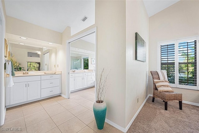 bathroom with tile patterned flooring and vanity