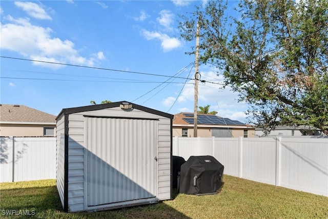 view of outbuilding with a yard