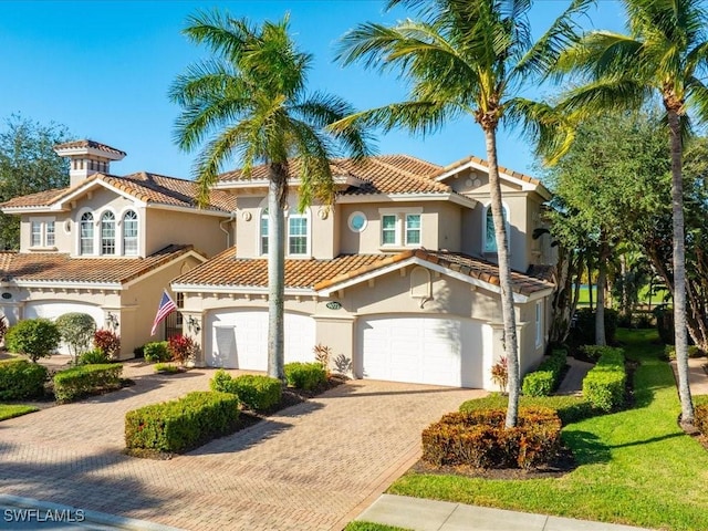 mediterranean / spanish house with a garage