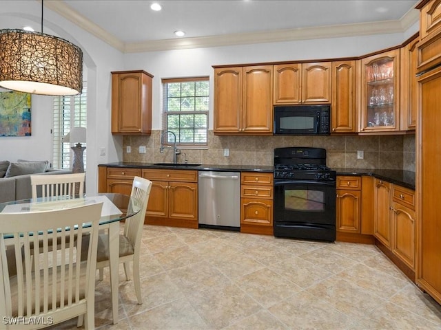 kitchen with sink, backsplash, decorative light fixtures, black appliances, and ornamental molding