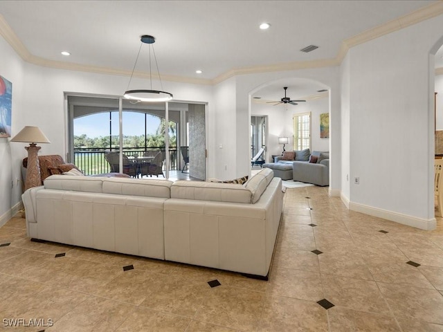 living room featuring ceiling fan, ornamental molding, and light tile patterned floors