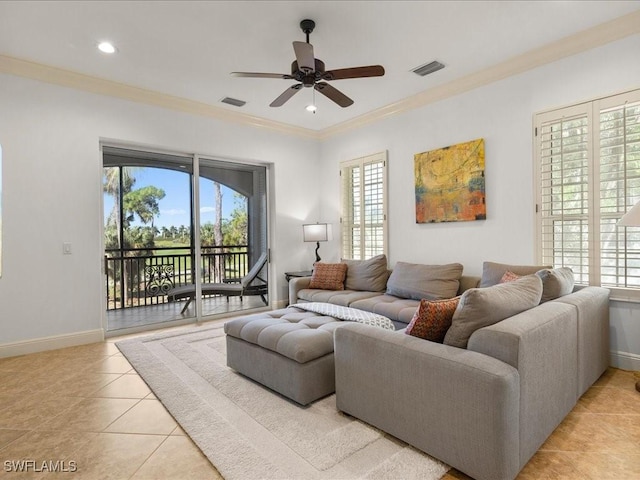 tiled living room with ceiling fan and ornamental molding