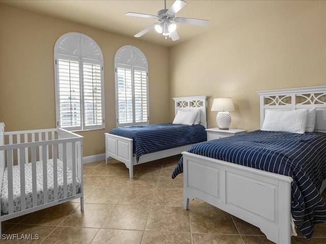 bedroom featuring ceiling fan and light tile patterned floors