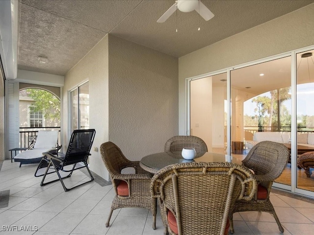 interior space with ceiling fan