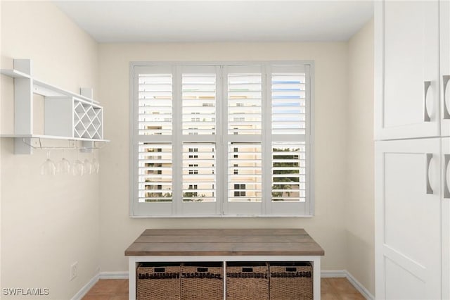 mudroom with light tile patterned floors