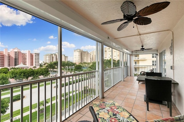 sunroom / solarium with ceiling fan