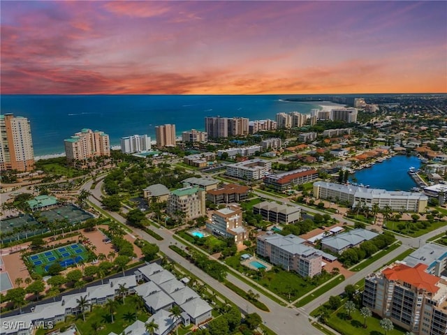 aerial view at dusk with a water view