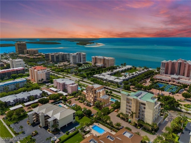 aerial view at dusk with a water view