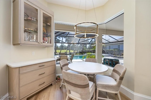 dining space with light hardwood / wood-style flooring