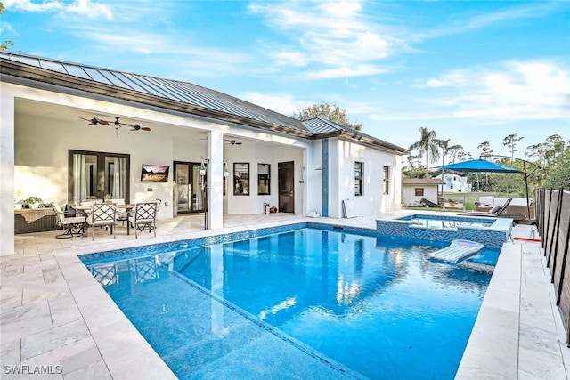 view of swimming pool featuring outdoor lounge area, an in ground hot tub, ceiling fan, and a patio