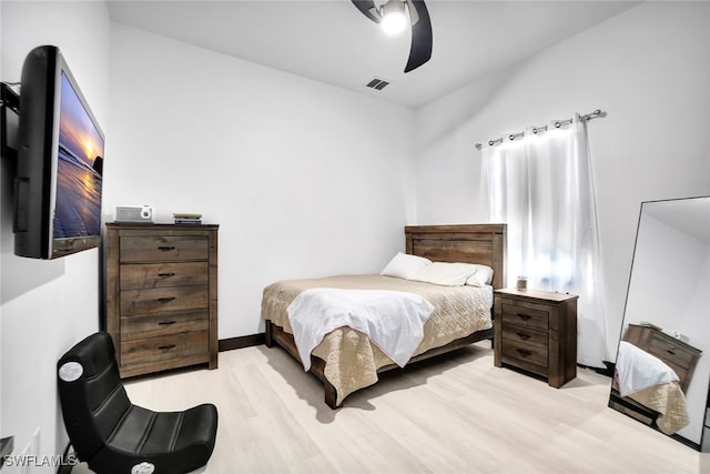 bedroom with light hardwood / wood-style floors and ceiling fan