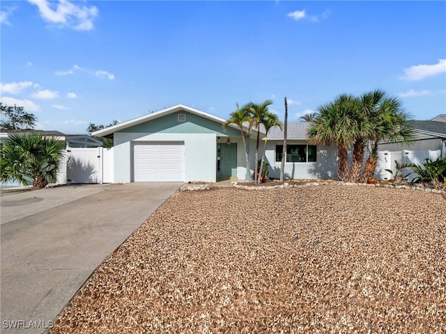 ranch-style home featuring a garage