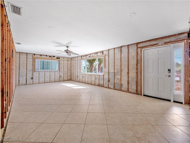 tiled foyer entrance with ceiling fan