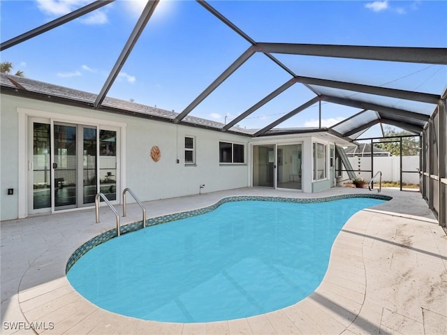 view of pool with a lanai and a patio area