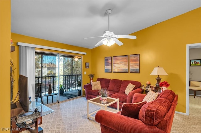 living room with ceiling fan and carpet