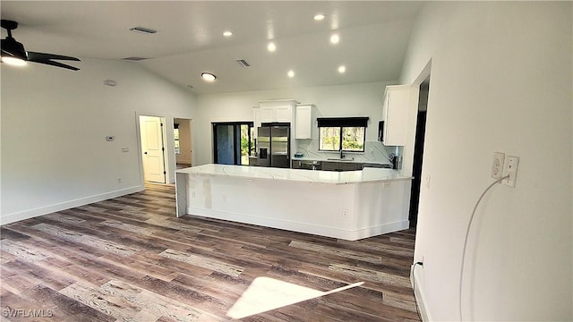 kitchen featuring ceiling fan, sink, white cabinets, stainless steel fridge with ice dispenser, and dark hardwood / wood-style floors