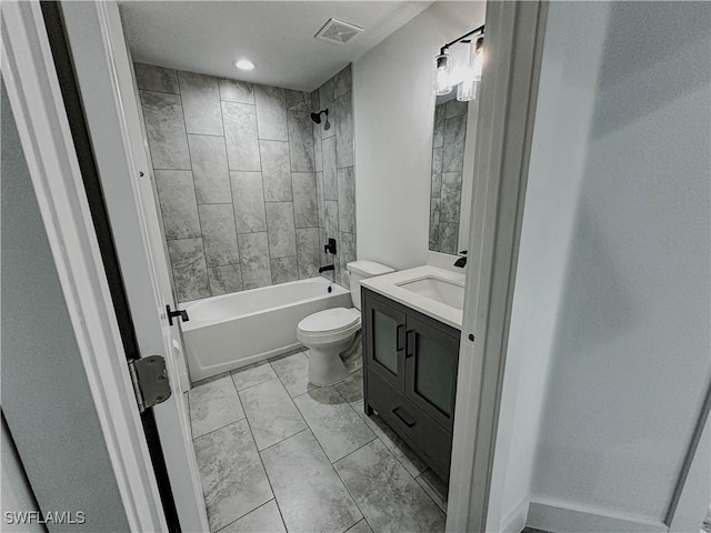 full bathroom featuring vanity, toilet, and tiled shower / bath