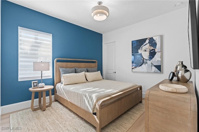 bedroom with light wood-type flooring