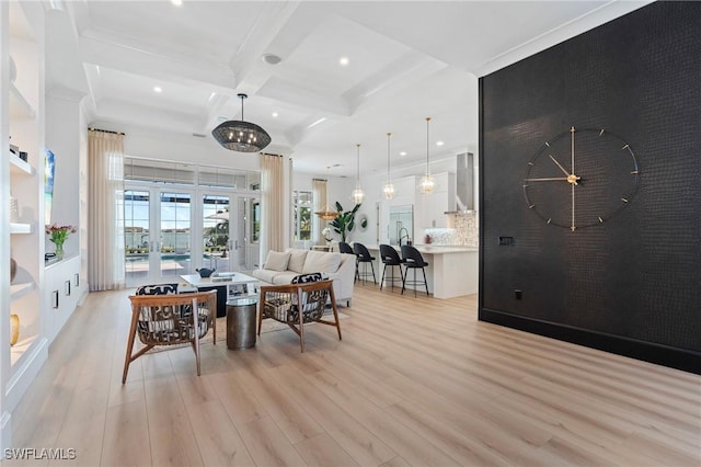 living room with coffered ceiling, beam ceiling, french doors, and light hardwood / wood-style flooring